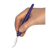 LM™ ErgoHold shown in hand. Surgical scalpel blade handle offers ergonomic comfort and precision for dental surgeries.